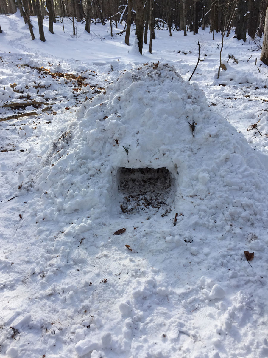 Our finished quinzhee (a snow shelter made by gathering a large pile of snow and then hollowing it out.)